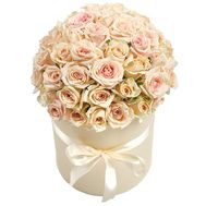 A bouquet of cream roses in a box