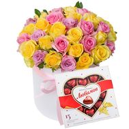 A bouquet of roses in a round box