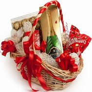 Sweets and champagne in the basket