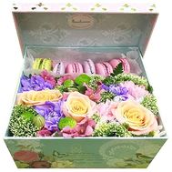Macarons with flowers in a box