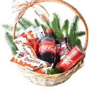 Christmas basket with sweets and Coca-Cola