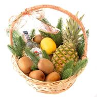 Christmas basket with vermouth and fruits