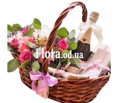 Basket with flowers and champagne