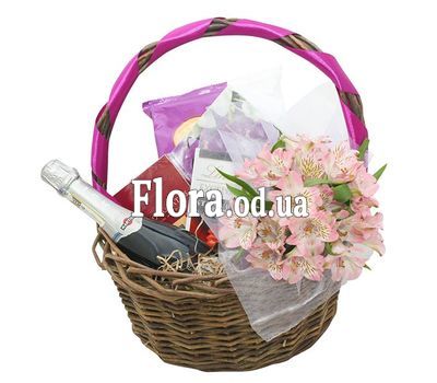 Sweets, flowers and champagne in the basket
