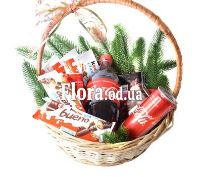 Christmas basket with sweets and Coca-Cola